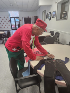 Connectedly's Outreach Coordinator collects clothing for a grandparent-headed family ahead of the holidays.